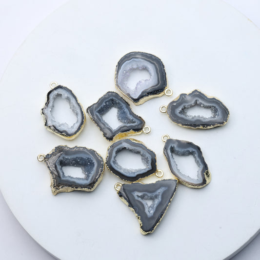 Grey agate geode druzy charms with gold-plated rims for DIY jewelry.