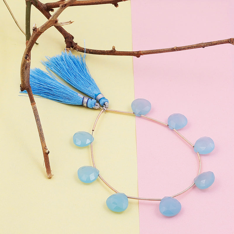 Blue teardrop briolette gemstone beads on strand with tassels